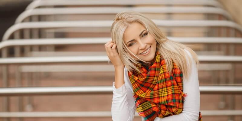 Typical Russian woman with light skin, high cheekbones, and blonde hair showcasing traditional Russian beauty features