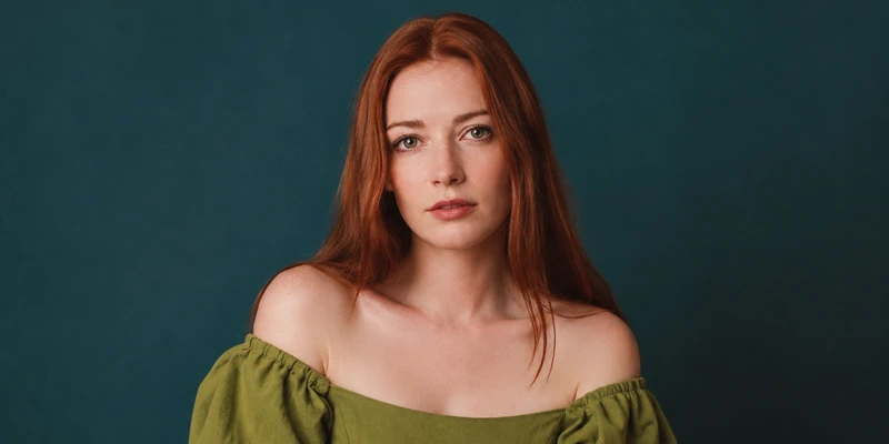Ukrainian woman with red hair and green eyes